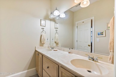 Welcome to this stunning 2,934 sq. ft. custom-built brick home on Carolina National Golf Club in North Carolina - for sale on GolfHomes.com, golf home, golf lot