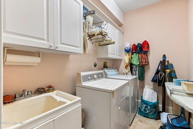 Welcome to this stunning 2,934 sq. ft. custom-built brick home on Carolina National Golf Club in North Carolina - for sale on GolfHomes.com, golf home, golf lot