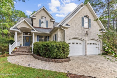 Welcome to this stunning 2,934 sq. ft. custom-built brick home on Carolina National Golf Club in North Carolina - for sale on GolfHomes.com, golf home, golf lot