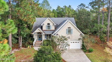 Welcome to this stunning 2,934 sq. ft. custom-built brick home on Carolina National Golf Club in North Carolina - for sale on GolfHomes.com, golf home, golf lot