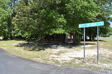 Corner, cul-de-sac lot located in a gated, lakeside, golf course on Players Course At Wyboo Plantation in South Carolina - for sale on GolfHomes.com, golf home, golf lot