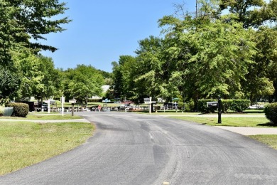 Corner, cul-de-sac lot located in a gated, lakeside, golf course on Players Course At Wyboo Plantation in South Carolina - for sale on GolfHomes.com, golf home, golf lot