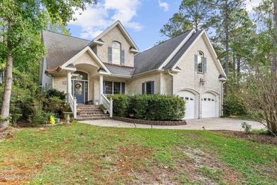 Welcome to this stunning 2,934 sq. ft. custom-built brick home on Carolina National Golf Club in North Carolina - for sale on GolfHomes.com, golf home, golf lot
