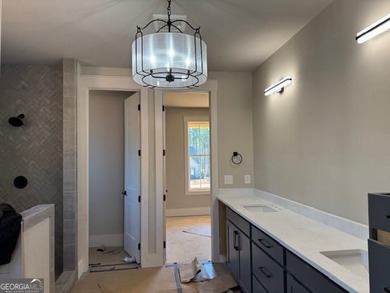 Luxury living awaits in River Forest, a premier swim, golf, and on The Club River Forest in Georgia - for sale on GolfHomes.com, golf home, golf lot