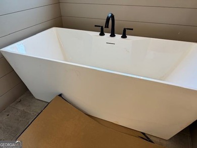 Luxury living awaits in River Forest, a premier swim, golf, and on The Club River Forest in Georgia - for sale on GolfHomes.com, golf home, golf lot