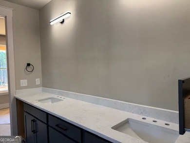 Luxury living awaits in River Forest, a premier swim, golf, and on The Club River Forest in Georgia - for sale on GolfHomes.com, golf home, golf lot