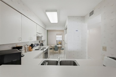 Isla del Sol Penthouse with Sweeping Water Views! Soaring above on Isla Del Sol Yacht and Country Club in Florida - for sale on GolfHomes.com, golf home, golf lot