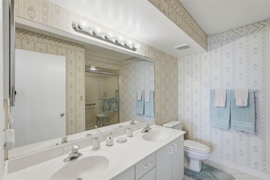 Isla del Sol Penthouse with Sweeping Water Views! Soaring above on Isla Del Sol Yacht and Country Club in Florida - for sale on GolfHomes.com, golf home, golf lot