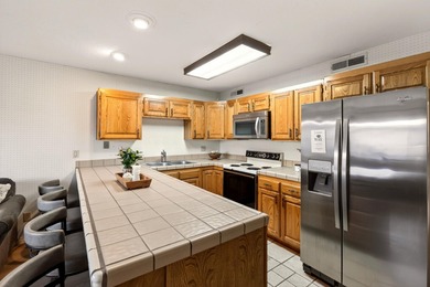 Fully furnished, main-level, low-vacancy investment condo in one on Sunbrook Golf Course in Utah - for sale on GolfHomes.com, golf home, golf lot