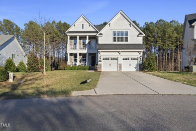 Nestled in the prestigious Hasentree Community this exceptional on Hasentree Club in North Carolina - for sale on GolfHomes.com, golf home, golf lot