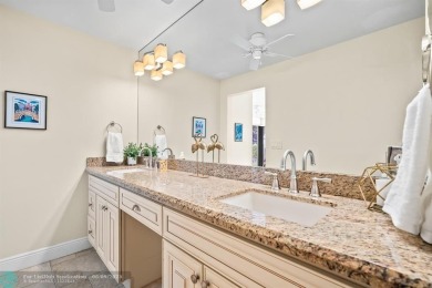 Unwind in luxury at this beautifully updated first floor on Boca West Golf and Country Club in Florida - for sale on GolfHomes.com, golf home, golf lot