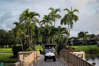 Unwind in luxury at this beautifully updated first floor on Boca West Golf and Country Club in Florida - for sale on GolfHomes.com, golf home, golf lot
