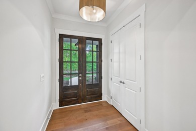 THERE'S SOMETHING MAGICAL ABOUT STEPPING INTO A NEW HOME, A on Harbor Club Golf and Country Club in Georgia - for sale on GolfHomes.com, golf home, golf lot