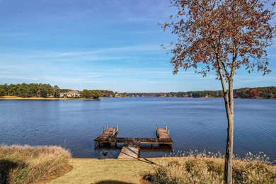 Enjoy the main lake views from spectacular corner condo in on The Golf Club at Cuscowilla in Georgia - for sale on GolfHomes.com, golf home, golf lot