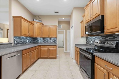 Welcome to this Beautifully Appointed Pool home in Gated on Stoneybrook Golf Club At Heritage Harbour in Florida - for sale on GolfHomes.com, golf home, golf lot