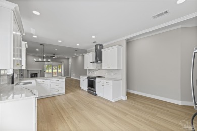 Beautifully updated home on the 13th tee of Tiger Point Golf on Tiger Point Golf and Country Club in Florida - for sale on GolfHomes.com, golf home, golf lot