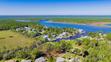 Embrace coastal living just minutes from the beach! This vacant on Orange Beach Golf Center in Alabama - for sale on GolfHomes.com, golf home, golf lot