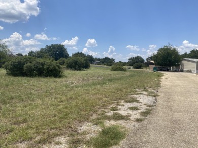 This large corner lot offers the best of both worlds: a tranquil on Slick Rock Golf Course - Horseshoe Bay in Texas - for sale on GolfHomes.com, golf home, golf lot