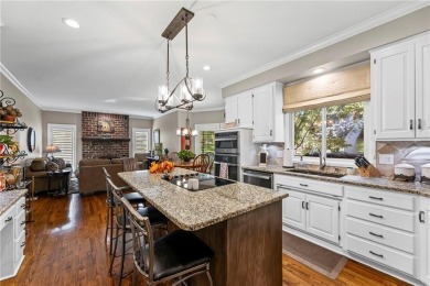 Discover a distinguished Tudor-style home by builder Jim Lambie on Leawood South Country Club in Kansas - for sale on GolfHomes.com, golf home, golf lot