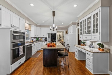 Discover a distinguished Tudor-style home by builder Jim Lambie on Leawood South Country Club in Kansas - for sale on GolfHomes.com, golf home, golf lot