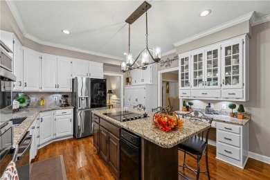 Discover a distinguished Tudor-style home by builder Jim Lambie on Leawood South Country Club in Kansas - for sale on GolfHomes.com, golf home, golf lot