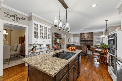 Discover a distinguished Tudor-style home by builder Jim Lambie on Leawood South Country Club in Kansas - for sale on GolfHomes.com, golf home, golf lot