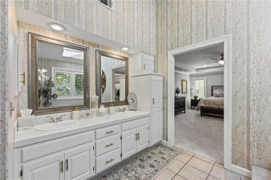 Discover a distinguished Tudor-style home by builder Jim Lambie on Leawood South Country Club in Kansas - for sale on GolfHomes.com, golf home, golf lot