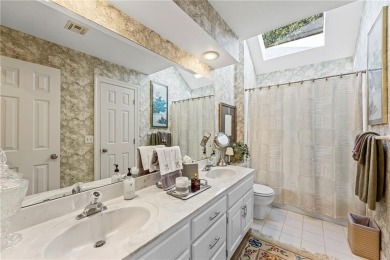Discover a distinguished Tudor-style home by builder Jim Lambie on Leawood South Country Club in Kansas - for sale on GolfHomes.com, golf home, golf lot