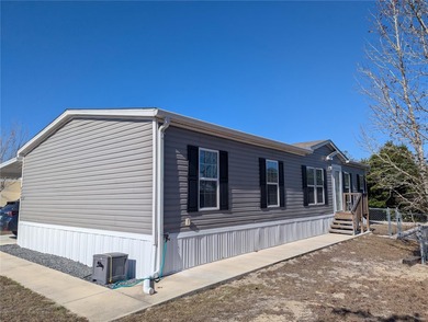 Welcome home to this beautifully maintained 2022 manufactured on Brookridge Country Club in Florida - for sale on GolfHomes.com, golf home, golf lot