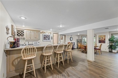 Discover a distinguished Tudor-style home by builder Jim Lambie on Leawood South Country Club in Kansas - for sale on GolfHomes.com, golf home, golf lot