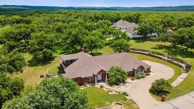 Live the life you've imagined. This spectacular home nestled in on Pecan Plantation Country Club in Texas - for sale on GolfHomes.com, golf home, golf lot