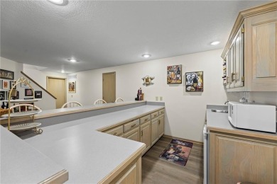 Discover a distinguished Tudor-style home by builder Jim Lambie on Leawood South Country Club in Kansas - for sale on GolfHomes.com, golf home, golf lot