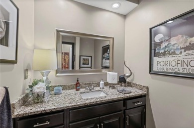 Discover a distinguished Tudor-style home by builder Jim Lambie on Leawood South Country Club in Kansas - for sale on GolfHomes.com, golf home, golf lot