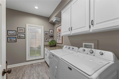 Discover a distinguished Tudor-style home by builder Jim Lambie on Leawood South Country Club in Kansas - for sale on GolfHomes.com, golf home, golf lot