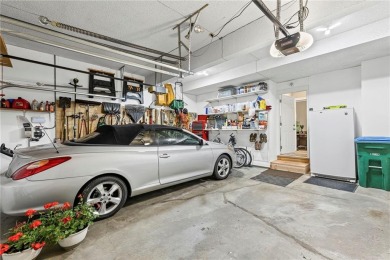 Discover a distinguished Tudor-style home by builder Jim Lambie on Leawood South Country Club in Kansas - for sale on GolfHomes.com, golf home, golf lot