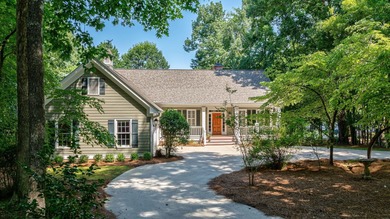 DISCOVER TIMELESS SOUTHERN ELEGANCE AND LUXURY LAKEFRONT LIVING on Great Waters Course At Reynolds Plantation in Georgia - for sale on GolfHomes.com, golf home, golf lot