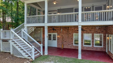 DISCOVER TIMELESS SOUTHERN ELEGANCE AND LUXURY LAKEFRONT LIVING on Great Waters Course At Reynolds Plantation in Georgia - for sale on GolfHomes.com, golf home, golf lot