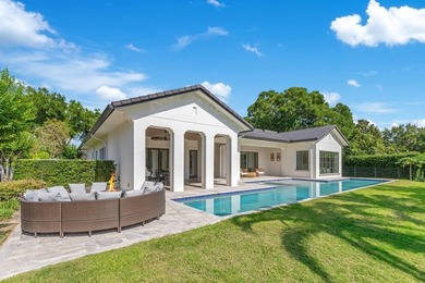 Fully rebuilt and expanded in 2019, this rare single-story on Isleworth Golf and Country Club in Florida - for sale on GolfHomes.com, golf home, golf lot