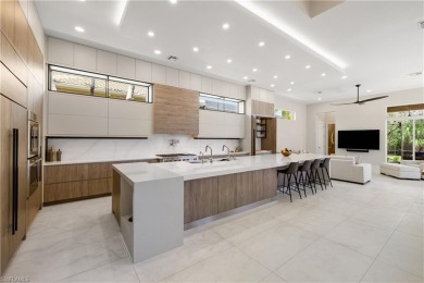 This fully renovated custom residence presents a rare on West Bay Beach and Golf Club in Florida - for sale on GolfHomes.com, golf home, golf lot