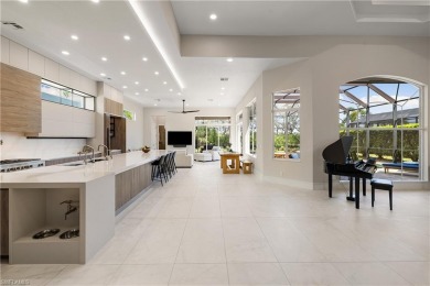 This fully renovated custom residence presents a rare on West Bay Beach and Golf Club in Florida - for sale on GolfHomes.com, golf home, golf lot