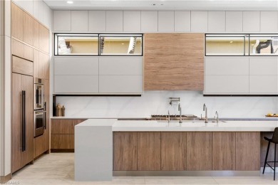 This fully renovated custom residence presents a rare on West Bay Beach and Golf Club in Florida - for sale on GolfHomes.com, golf home, golf lot