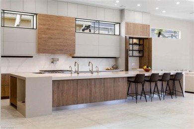 This fully renovated custom residence presents a rare on West Bay Beach and Golf Club in Florida - for sale on GolfHomes.com, golf home, golf lot