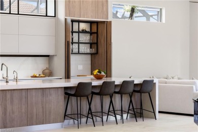 This fully renovated custom residence presents a rare on West Bay Beach and Golf Club in Florida - for sale on GolfHomes.com, golf home, golf lot