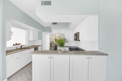Lovely Oak Harbor condo residence that lives like a home on Oak Harbor Country Club in Florida - for sale on GolfHomes.com, golf home, golf lot