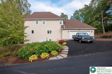 Welcome to this magnificent 3-level residence offering an on Country Club of the Poconos Golf Course in Pennsylvania - for sale on GolfHomes.com, golf home, golf lot