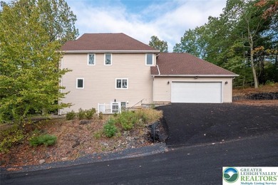 Welcome to this magnificent 3-level residence offering an on Country Club of the Poconos Golf Course in Pennsylvania - for sale on GolfHomes.com, golf home, golf lot