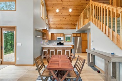 Experience refined lake living in this stunning 3BR, 2BA home on Northern Bay Golf Resort and Marina in Wisconsin - for sale on GolfHomes.com, golf home, golf lot