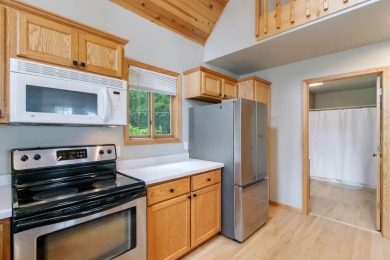 Experience refined lake living in this stunning 3BR, 2BA home on Northern Bay Golf Resort and Marina in Wisconsin - for sale on GolfHomes.com, golf home, golf lot