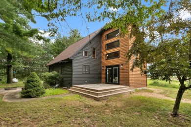 Experience refined lake living in this stunning 3BR, 2BA home on Northern Bay Golf Resort and Marina in Wisconsin - for sale on GolfHomes.com, golf home, golf lot