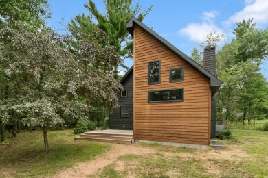 Experience refined lake living in this stunning 3BR, 2BA home on Northern Bay Golf Resort and Marina in Wisconsin - for sale on GolfHomes.com, golf home, golf lot